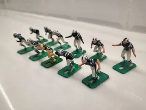Miniature Baltimore Colts electronic football player figurines in blue uniforms set