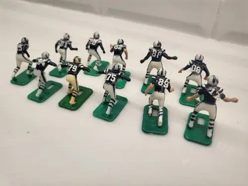 Vintage NFL Baltimore Colts electronic football player figurines in blue uniforms