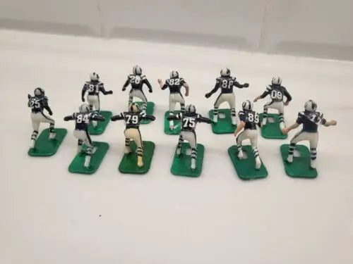 Miniature Baltimore Colts electronic football player figurines in blue uniforms set