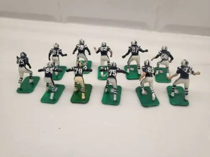 Miniature Baltimore Colts electronic football player figurines in blue uniforms set