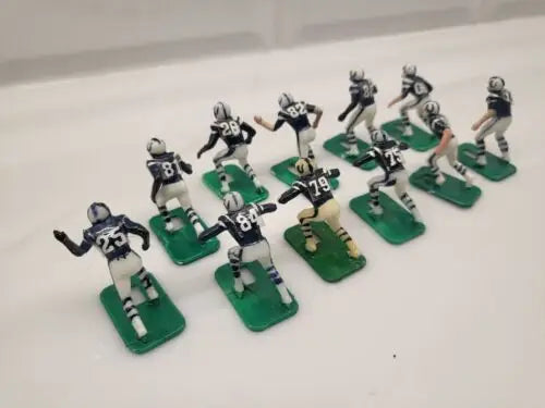 Miniature Baltimore Colts electronic football player figurines in blue uniforms set