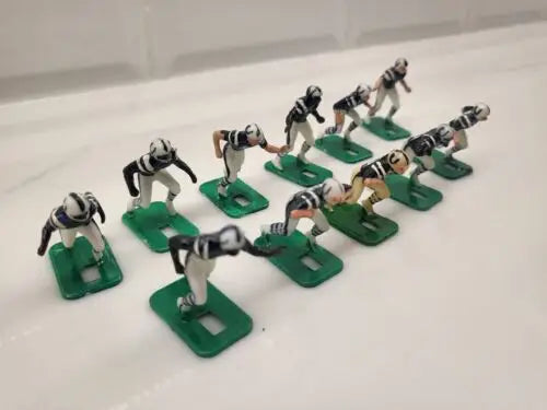 Vintage football figurines from the Vintage NFL Baltimore Colts Electronic football set in blue uniforms