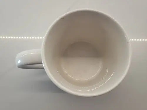 Empty white ceramic mug featuring Joe Namath Canton Ohio Pro Football Hall of Fame design