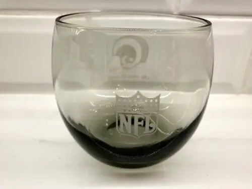 Gray glass tumbler featuring NFL and Los Angeles Rams logos for whiskey lovers