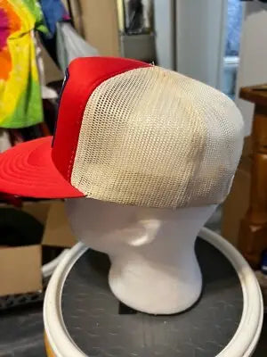 Red and beige mesh trucker hat on white mannequin head in Vintage Ontario Retro Trucker SnapBack Hat display