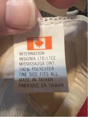 White clothing tag with Canadian flag showing brand, material, size, and made in Canada for Vintage Ontario Retro Trucker SnapBack Hat