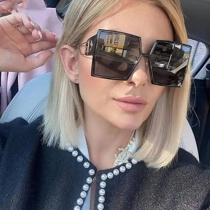 Vintage Oversize Sweetie Sunglasses with black frame, gold accents, and polarized lenses