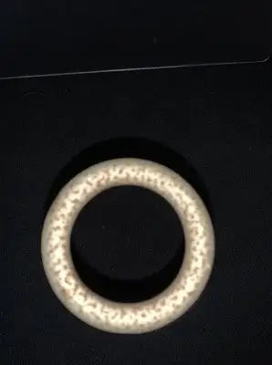 Textured light-colored circular ring from Vintage 1963 Texas Longhorns National Champions Megaphone