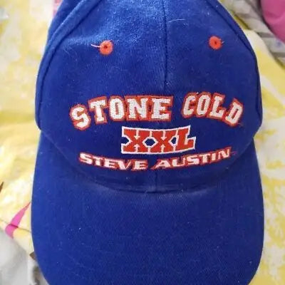 Blue vintage Stone Cold Steve Austin baseball cap with WWF WWE branding and red white lettering