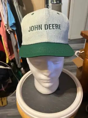 White and green John Deere hat on mannequin head, vintage unisex Deere hat