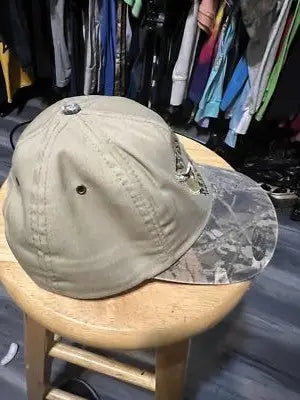 Vintage Wolf Mountain SnapBack Hat featuring a tan body and camouflage brim