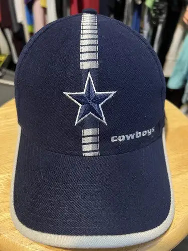 Navy blue Dallas Cowboys baseball cap with NFL logo and white star logo athletic trim