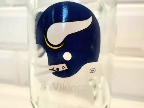 Minnesota Vikings Logo beer stein featuring a vintage NFL design with a helmet graphic