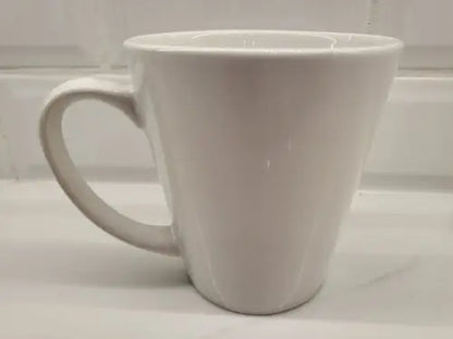 White ceramic coffee mug featuring York Jets logo and green accents