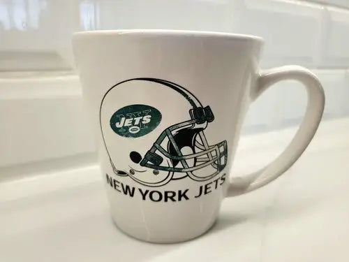 New York Jets green ceramic coffee mug featuring logo design and helmet graphic