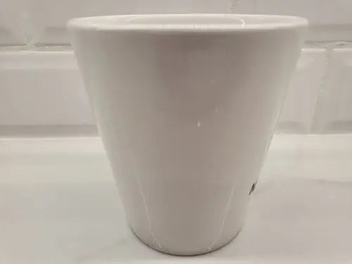 White ceramic coffee mug featuring York Jets logo in green ceramic design