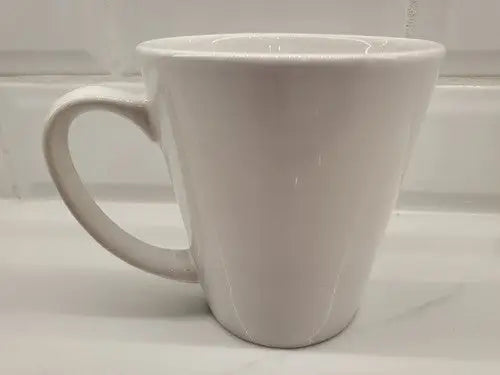 White ceramic coffee mug featuring NY Jets logo in green ceramic design