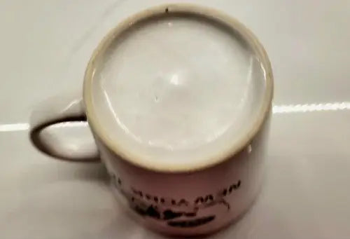 Green ceramic coffee mug featuring York Jets logo and handle in product display