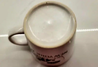 Green ceramic coffee mug featuring York Jets logo and handle in product display