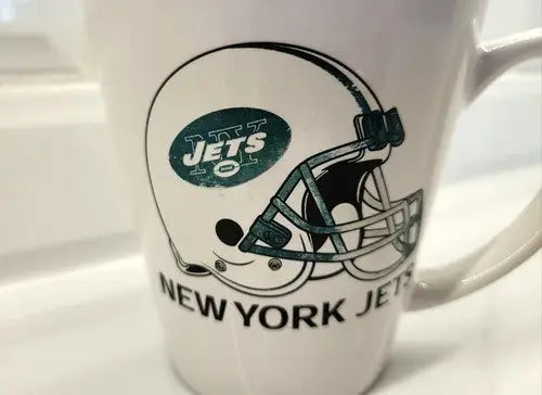 New York Jets green ceramic coffee mug featuring the team logo and helmet design