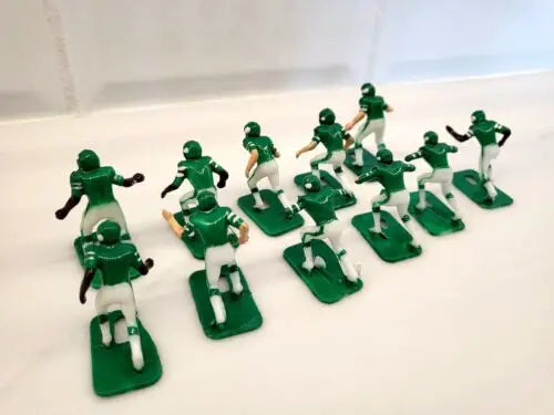 Green and white plastic figures from Vtg Tudor New York Jets Electronic Football set