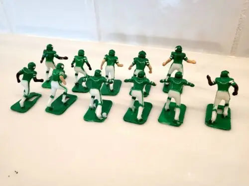 Green and white plastic football figures for York Jets electronic football game