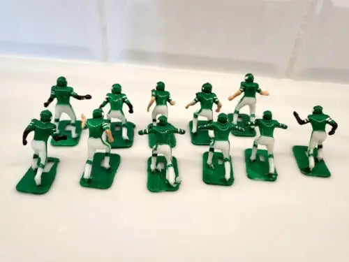 Green and white plastic football figurines from Vtg Tudor New York Jets Electronic Football