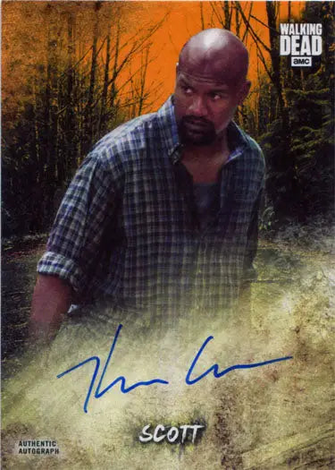 Man with a beard in plaid shirt against forest backdrop on Kenric Green trading card