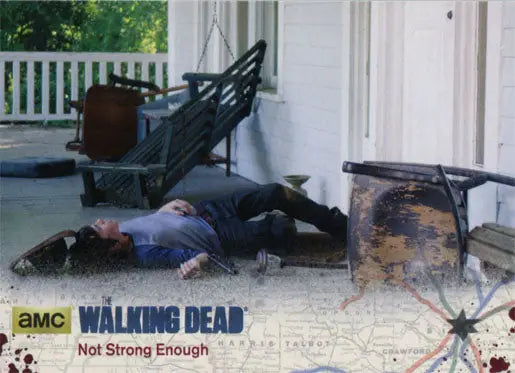 Person lying face-up on porch featured in Walking Dead Season 4 silver parallel trading card