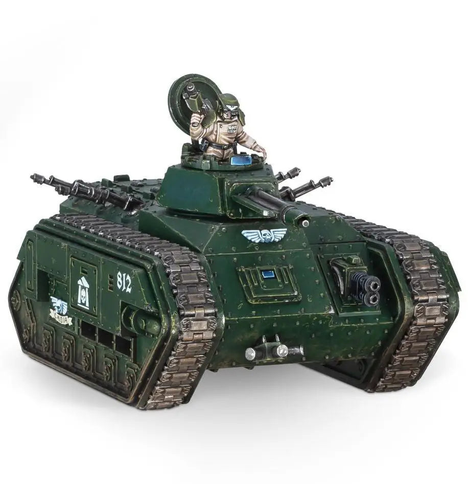 Astra Militarum green military tank model with open turret and figure holding weapon