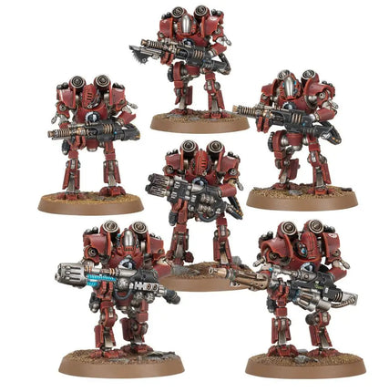 Six miniature red and silver robot figures with weapons from Warhammer HORUS HERESY Mechanicum Combat Force featuring shock chargers and Thanatar Cavas Siege-Automata