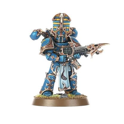 Painted miniature of Blue and Gold Rubric Marines warrior with ornate rifle for Warhammer