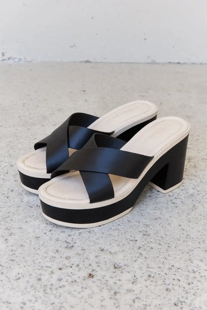 Black and white Weeboo Cherish platform sandals with crisscross straps and heel height