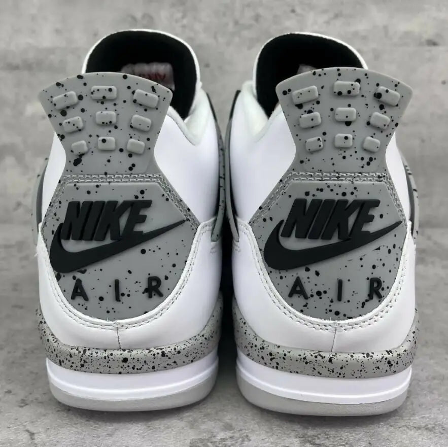 White Cement Air Jordan 4 Retro athletic shoes with Nike branding, fast shipping available