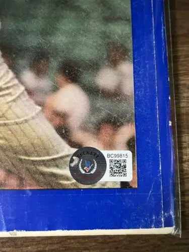 Baseball card of Whitey Ford with Beckett Authentication Services sticker from Sports Illustrated
