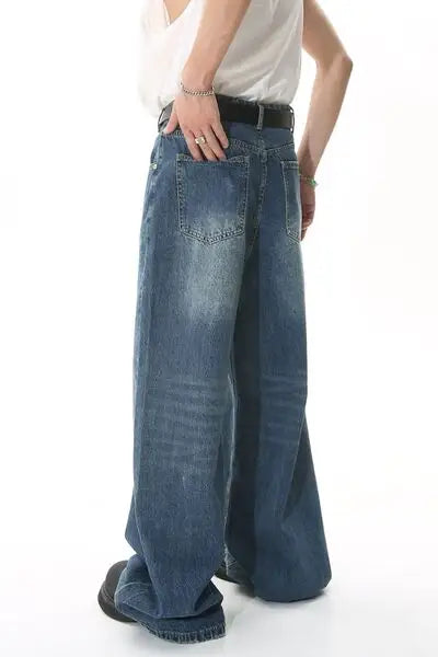 Loose-fitting distressed blue jeans with a black belt from Wide Leg Jeans with Pockets