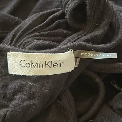 Black Calvin Klein floor length gown with label and made in China tag