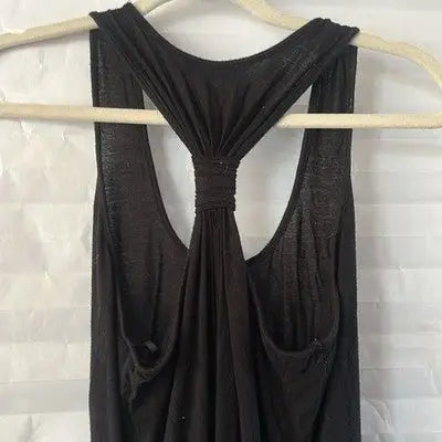 Black Calvin Klein floor length racerback tank top hanging on a hanger