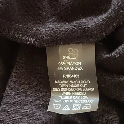 Clothing care label with fabric details and washing instructions for Calvin Klein floor length gown
