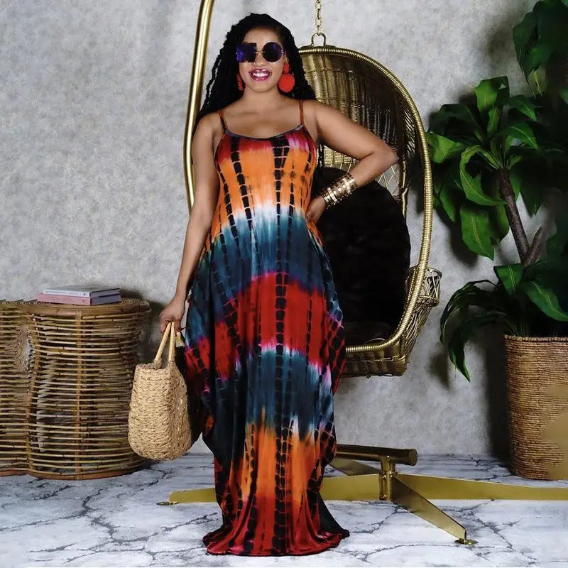 Woman in colorful tie-dye casual long dress with spaghetti straps, perfect for fashion casual long style