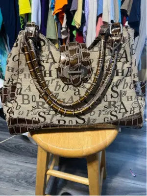 Sag Harbor Women’s Tote Bag with beige and brown pattern, decorative buckle, braided handles