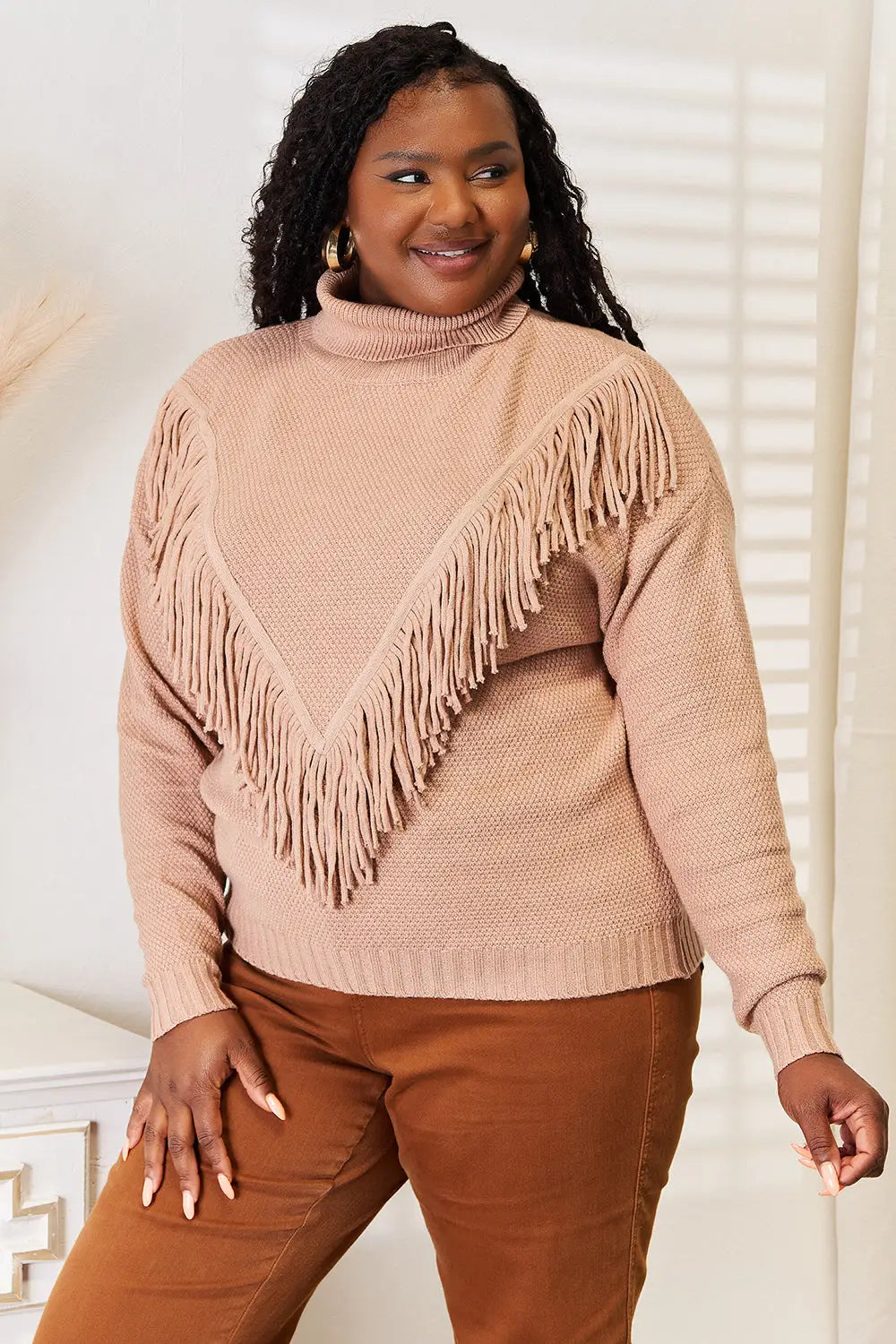 Blush pink turtleneck fringe long sleeve sweater with textured knit design
