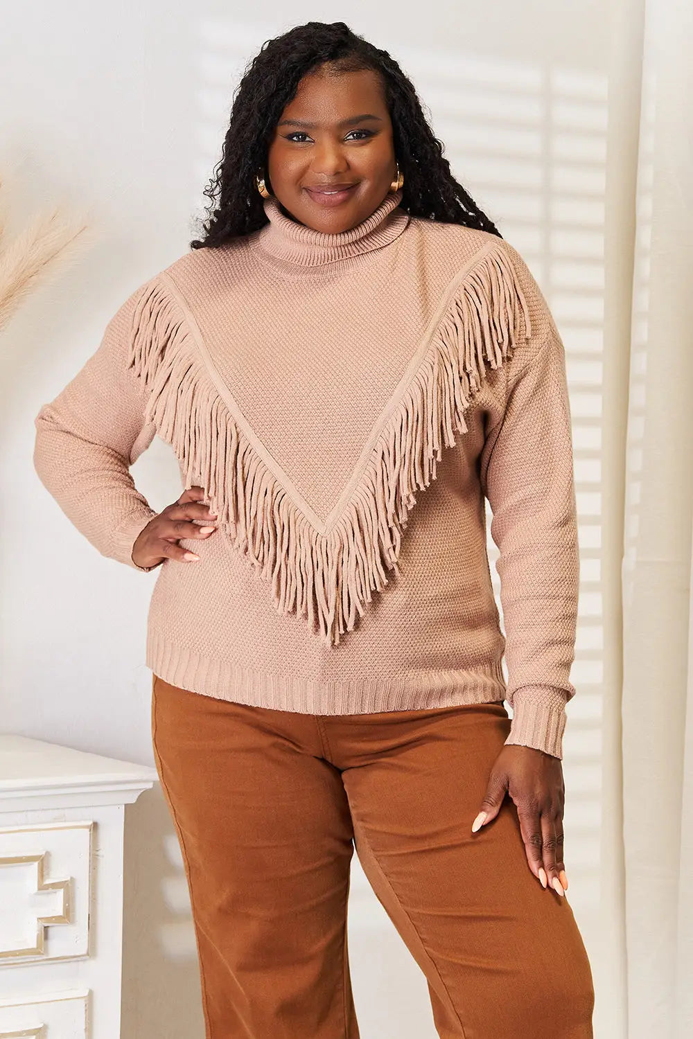 Blush pink turtleneck fringe long sleeve sweater with high neck and fringe front detail