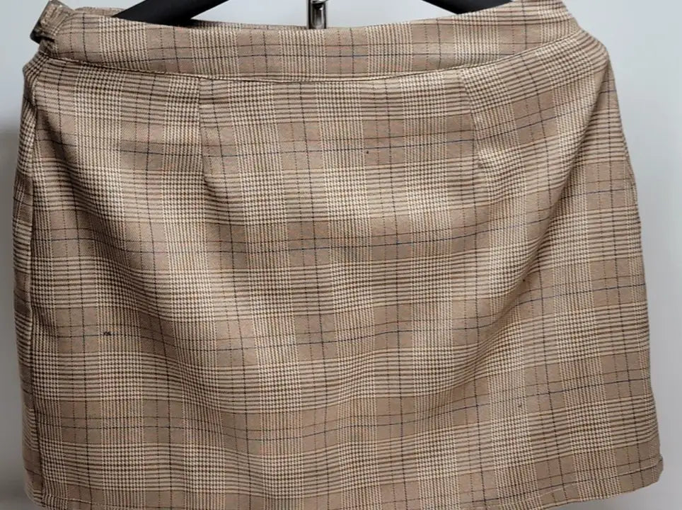 Tan plaid mini skirt with black grid pattern from Y2K Plaid Mini Skirt Hesperus