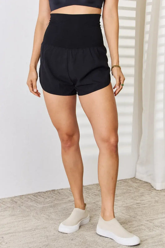 Black high-waisted tummy control athletic shorts with drawstring and side pockets