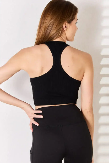 Black ribbed racerback tank top with high cutout back for athletic style