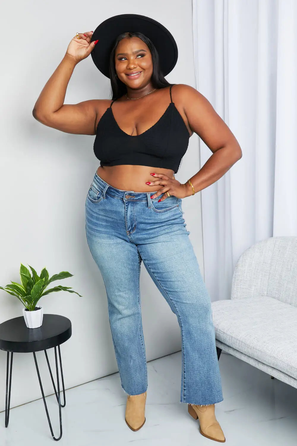 Black textured spaghetti strap bralette with deep neckline and stretchy fabric