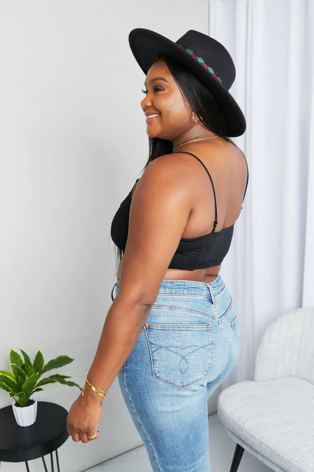 Black felt fedora hat with green and red embroidery, textured spaghetti strap style