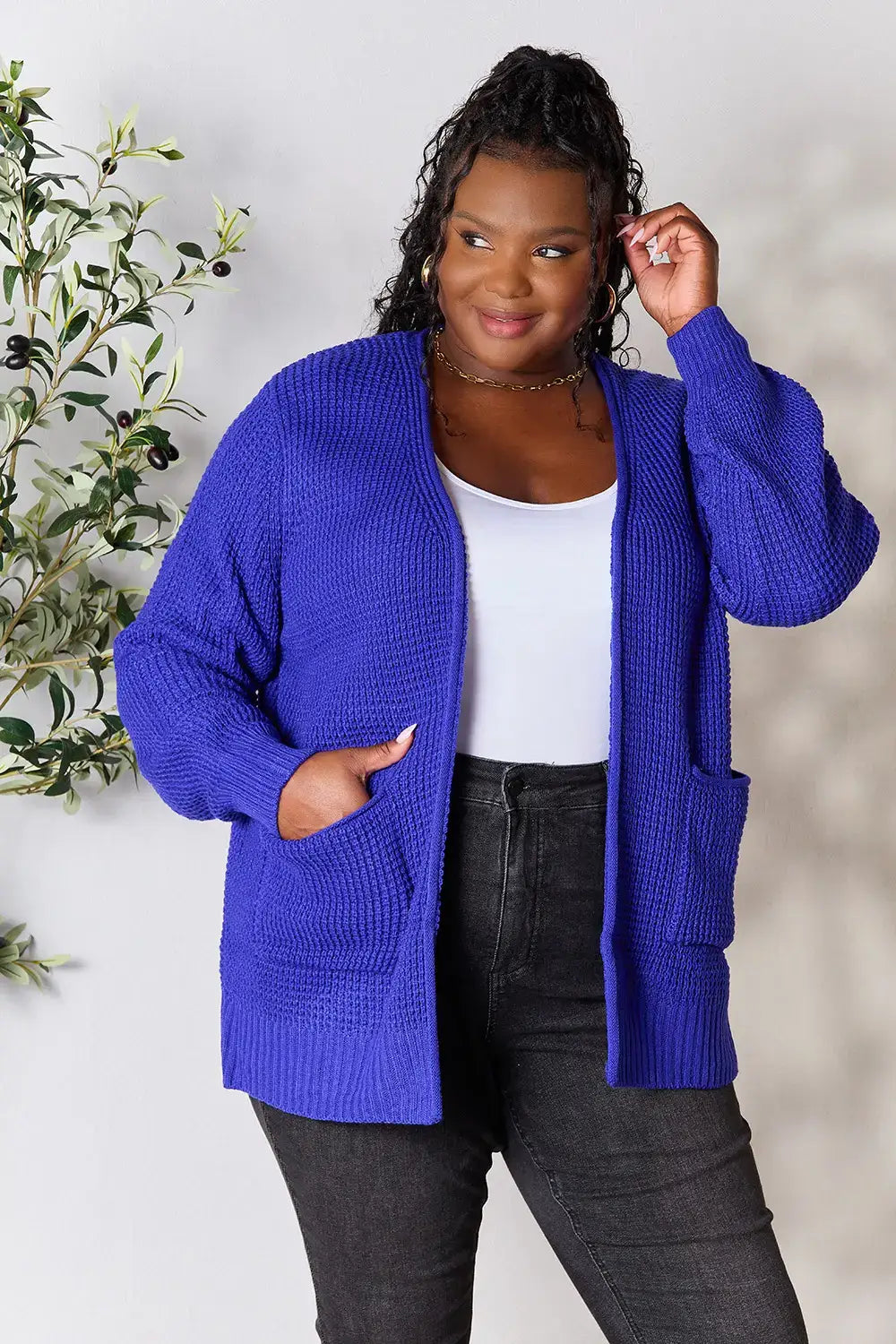 Plus-size woman wearing Zenana royal blue waffle-knit open front cardigan with relaxed fit
