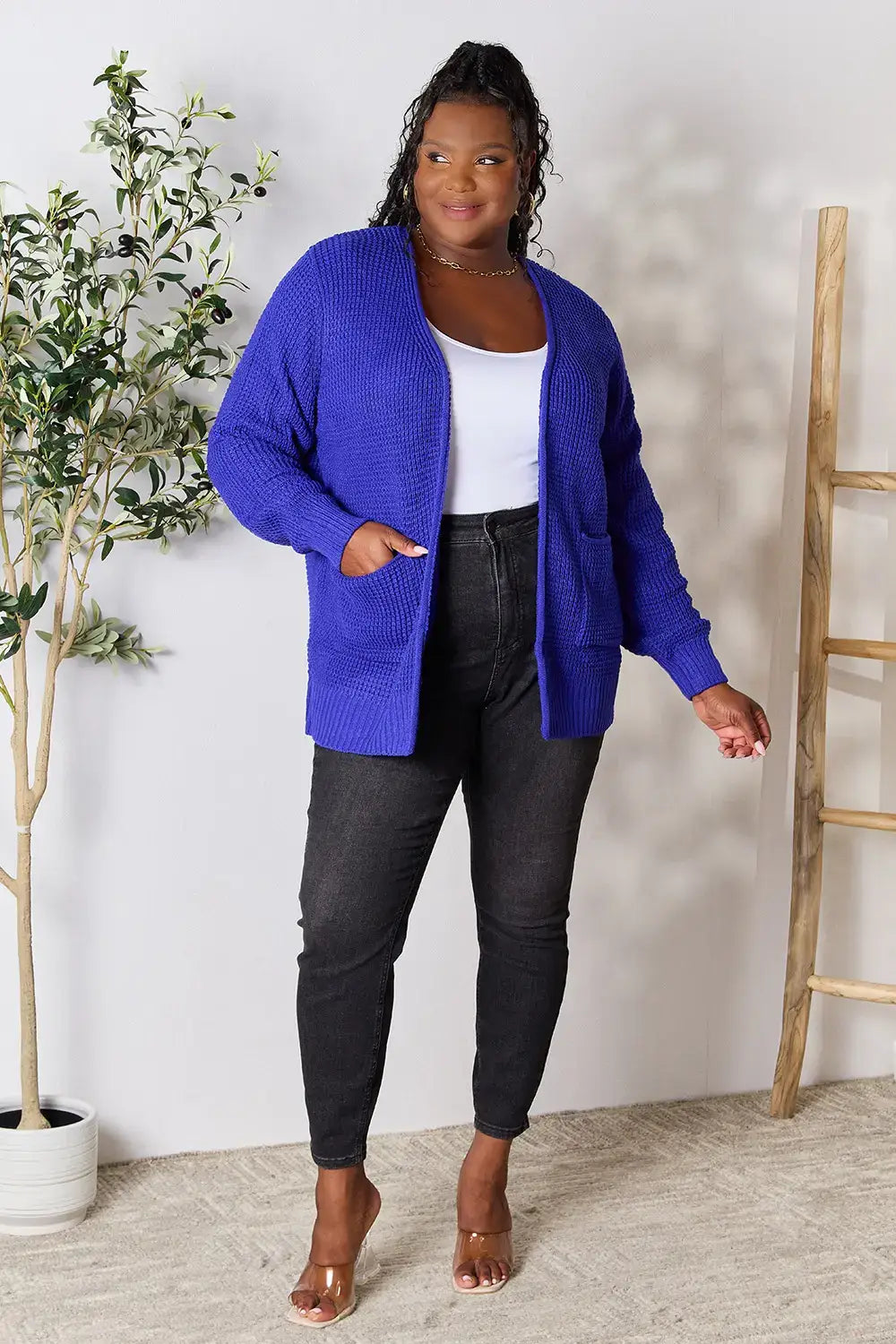 Women’s royal blue open-front cable knit cardigan with relaxed fit and moderate stretch